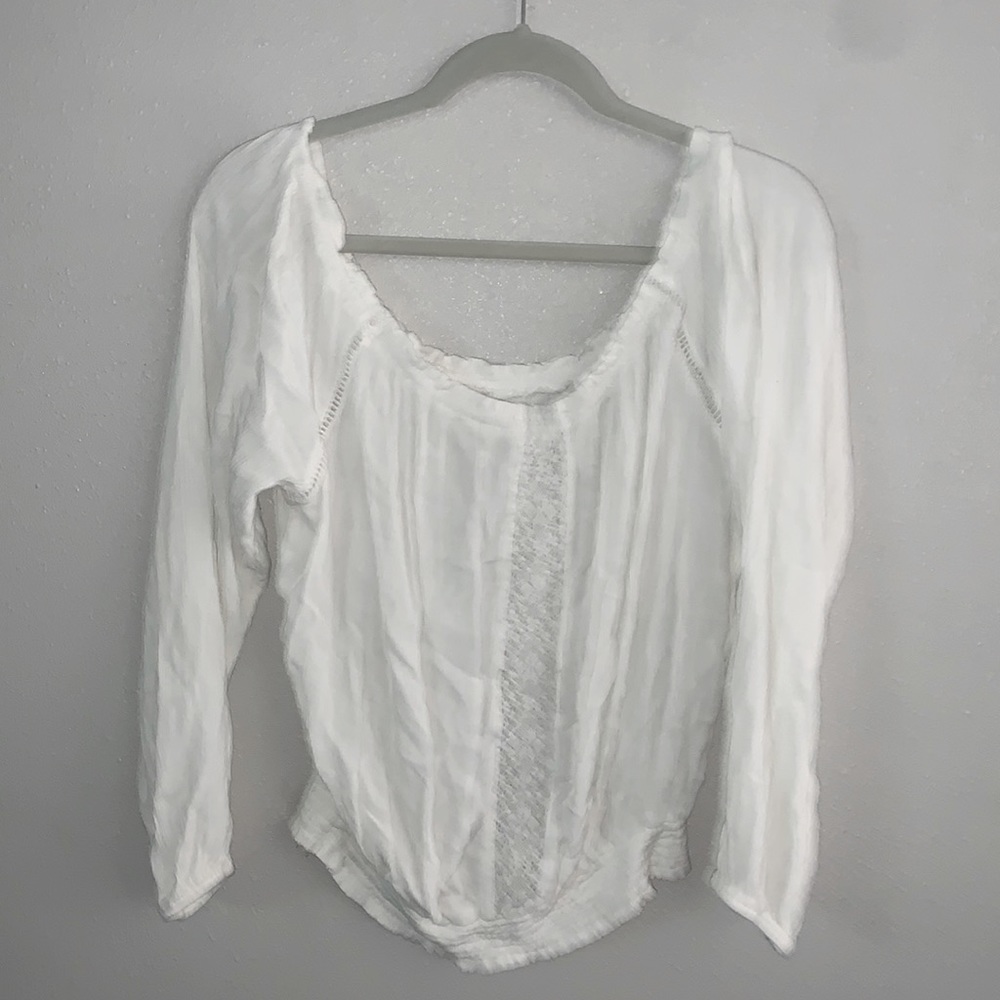 White blouse, can go over shoulders